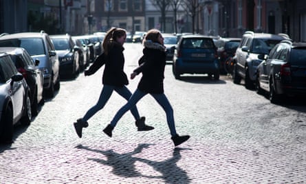 Two children cross a road in Dusseldorf