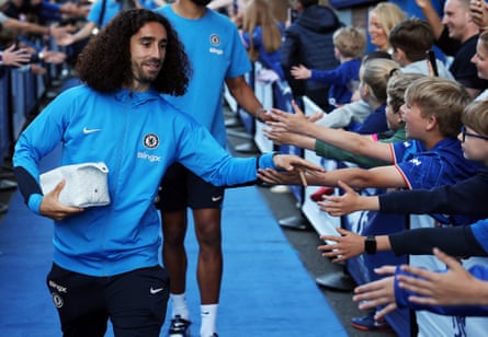 Marc Cucurella is greeted by young fans outside Stamford Bridge in May 2025.