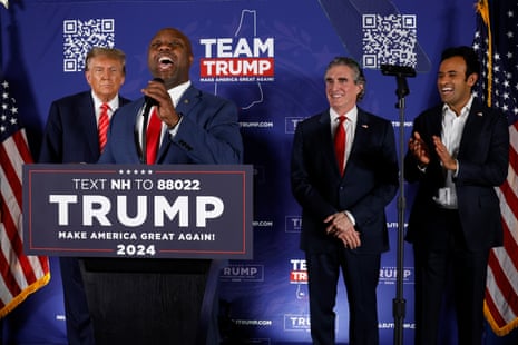 Senator Tim Scott (2nd-R), Donald Trump (L), Doug Burgum (2nd-R) and Vivek Ramaswamy (R) at a campaign rally in the basement ballroom of The Margate Resort in Laconia, New Hampshire.