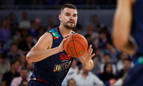 Isaac Humphries holds the basketball during a game