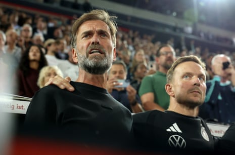 Jurgen Klopp, head Coach of Germany, sings the national anthem.