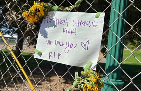 A sign reading ‘Fly High Charlie Kirk! We love you. R.I.P'