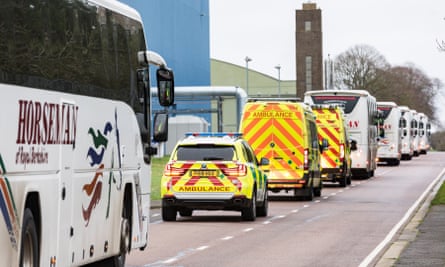 The convoy transporting British nationals who had arrived from Wuhan to the Wirral on Friday