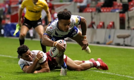 Regan Grace scores St Helens’ third try against Wigan in the Super League match at the AJ Bell Stadium.