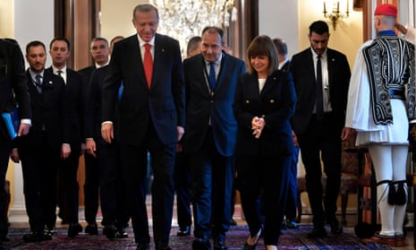 Greece’s President Katerina Sakellaropoulou, right, walk with her Turkish counterpart Recep Tayyip Erdogan, left, before their meeting at the Presidential Palace in Athens, Greece, Thursday, Dec. 7, 2023. Erdogan arrived in Greece on a visit designed to set the historically uneasy neighbors on a more constructive path and help repair strained his country’s strained relationship with the European Union.