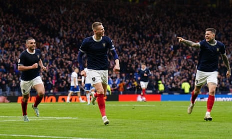 At the double: Scotland's Scott McTominay (centre) celebrates with team-mates .