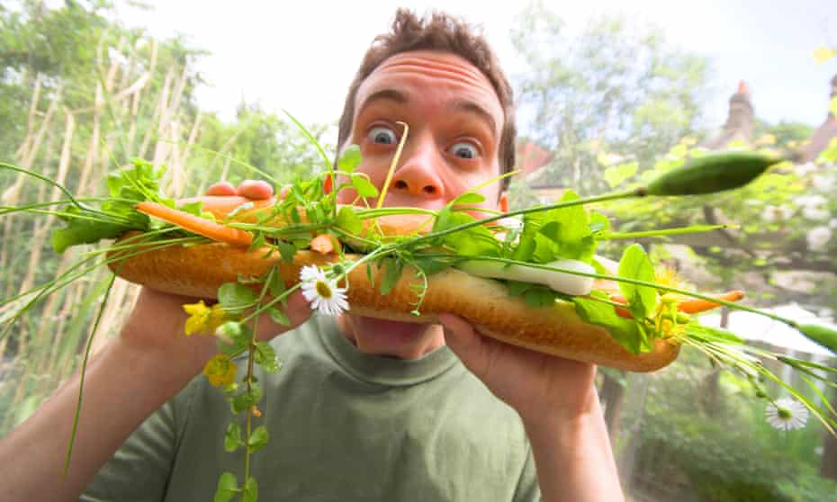 A twenty-something white male attacks an enormous veggie meal