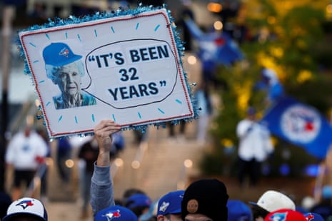 A supporter of the Toronto Blue Jays displays a sign before Game 7 of the World Series on Saturday night.