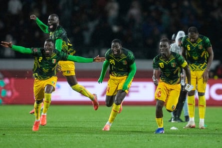 Mali players celebrate the penalty shootout win over Tunisia.