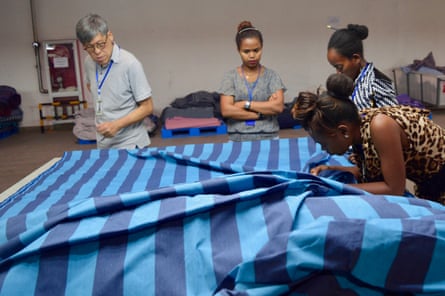 Peter Wan, from the Chinese company Wuxi Jinmao, inspects fabrics at Hawassa Industrial Park.