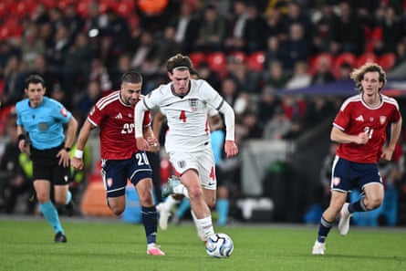 Alex Scott (centre) carries the ball forward against Czechia in Prague