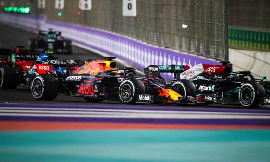 Max Verstappen (left) challenges Lewis Hamilton for track advantage.
