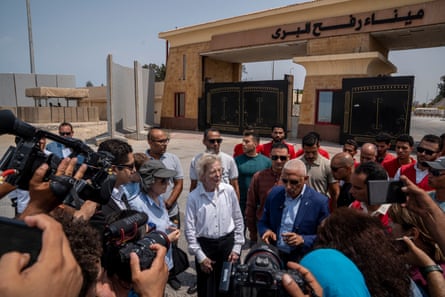 A delegation from The Elders in Rafah, Egypt, with cameramen at the side