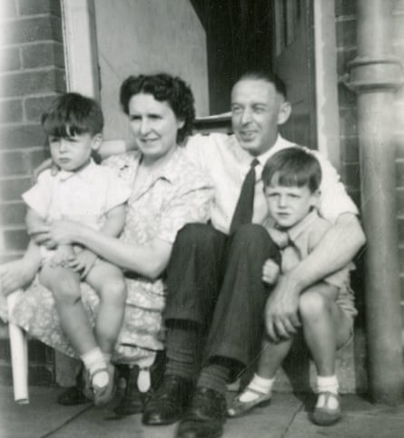 A black and white photograph of two young boys and their parents back in the 1940s.