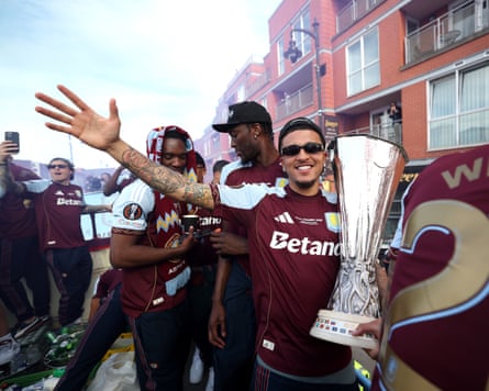 Jadon Sancho of Aston Villa celebrates with the Europa League trophy during the team’s victory parade.