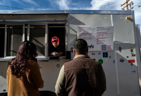 Chef Ray Naranjo, owner of Manko, a food truck specializing in Native American fusion, takes the first orders of the day at an event in Española, New Mexico.