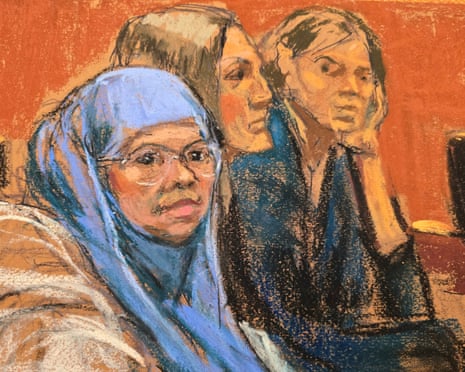 a courtroom sketch shows a woman sitting with her lawyers
