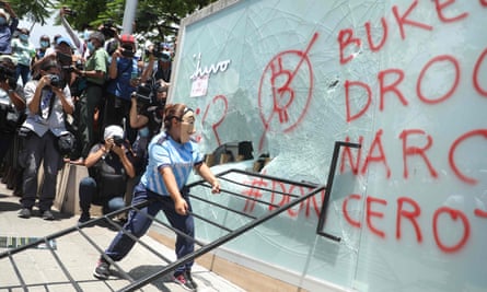 A demonstrator vandalises a Chivo Wallet bitcoin ATM during a protest against President Nayib Bukele’s policies on Independence Day in San Salvador, 15 September.
