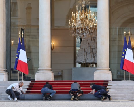 A red carpet is installed in the courtyard of the Élysée Palace ahead of the pope arrival for a meeting with French President.