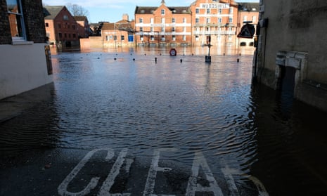 Water spills over the banks of the River Ouse in York on Sunday.