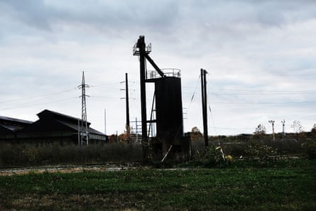 Dilapidated industrial equipment decays in an industrial area,