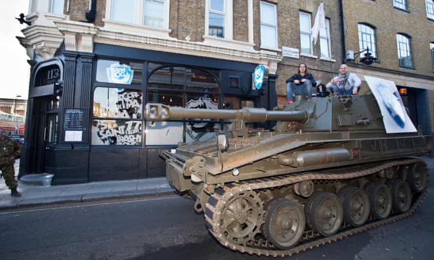 Dickie and Watt drive a tank through Camden in north London