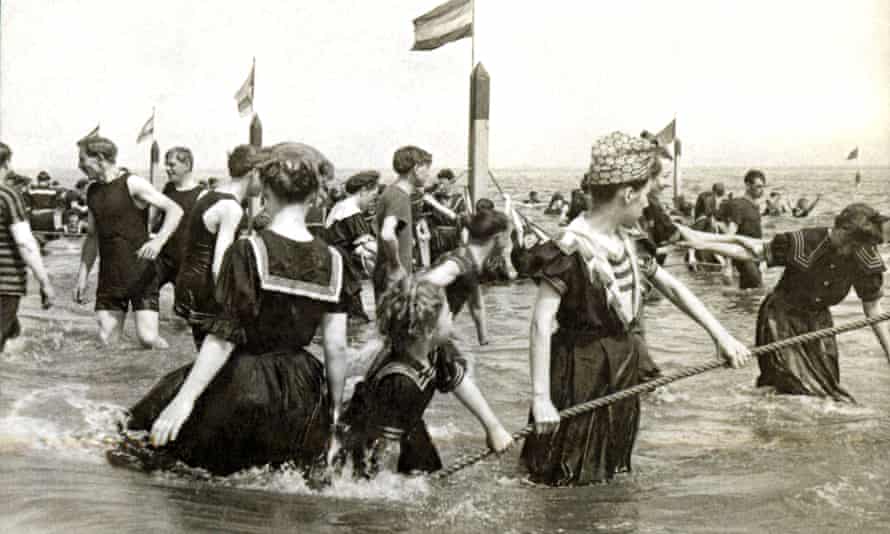 Bathers in the breaking waves of the Atlantic at Coney Island, New York.
