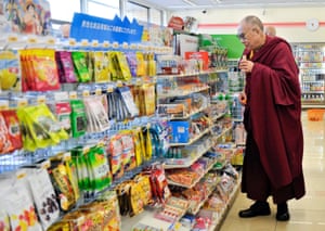 Tibetan spiritual leader Dalai Lama visits a convenience store in Katsuragi, western Japan in 2011 on the way from Koyasan to Sendai, which was devastated by the tsunami. The Dalai Lama held a Buddhist memorial service for the more than 20,000 killed.