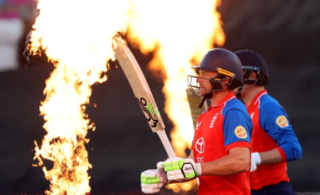 England's Jos Buttler walks out to bat before the start of the innings.