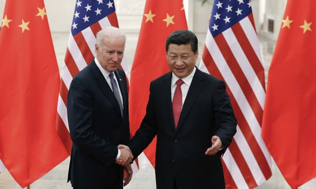 Joe Biden and Xi Jinping shake hands in Beijing, in 2013.