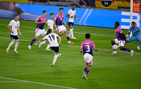England's Harvey Elliott hits a left footed shot though the German defence to open the scoring.