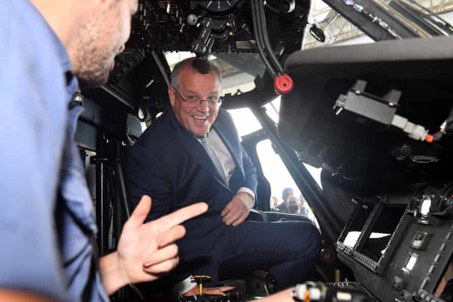 Prime minister Scott Morrison looks at a Sikorsky SH-60/MH-60 Seahawk helicopter at HMAS Albatross in Nowra, in the seat of Gilmore