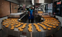 Krispy Kreme doughnuts coming off the production line at the new outlet in Paris last week.