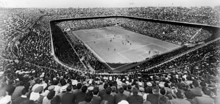 A large crowd watching a football match in the 1950s at the San Siro Stadium in Milan, originally built in 1926.