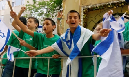 boys wave israel flags