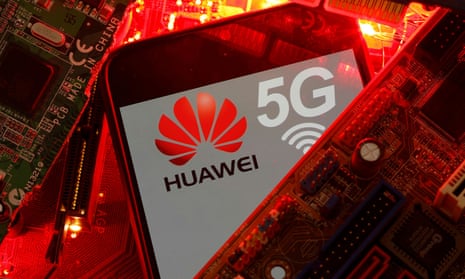 A smartphone with the Huawei logo among some PC motherboards