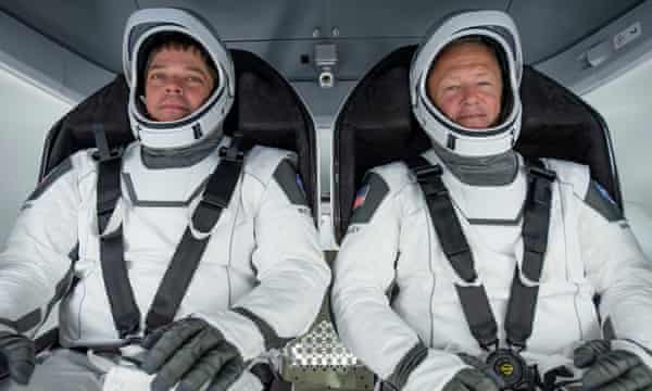Doug Loverro has resigned from Nasa just over a week before astronauts Bob Behnken (L) and Doug Hurley (R) are due to head on a mission to the International Space Station.