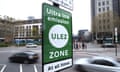 An ultra low emission zone sign on a busy road in London.