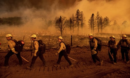 Firefighters in California battle the Sugar Fire in Doyle on 9 July 2021.