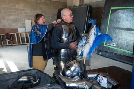 Sir Andrew McKinnon is helped into his armour.