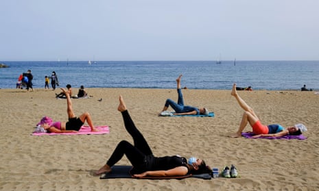 A yoga session at a beach in Barcelona