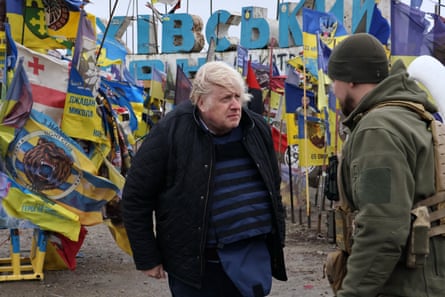 Boris Johnson talks with a Ukrainian serviceman in the frontline town of Orikhiv in the Zaporizhzhia region, Ukraine.