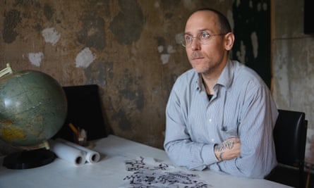 ‘My parents weren’t impressed at first, but now I do my mum’: meet some of the world’s best tattoo artists 24 Tattoo Artist Brody Polinsky in his studio in Berlin with some of his artworks and a globe on the table