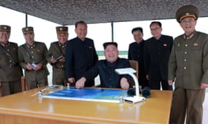 Kim Jong-un watches the launch of an intermediate-range missile, in an image released by North Korea’s official KCNA news agency.
