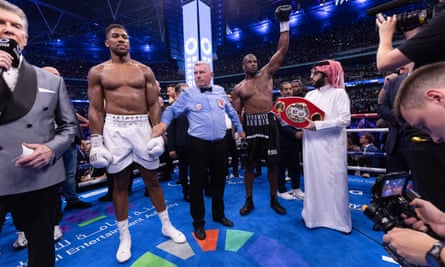 Daniel Dubois has his hand raised alongside ring announcer Michael Buffer and chair of Saudi Arabia’s General Entertainment Authority, Turki al-Sheikh.