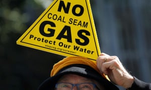 woman with a no coal seam gas sign