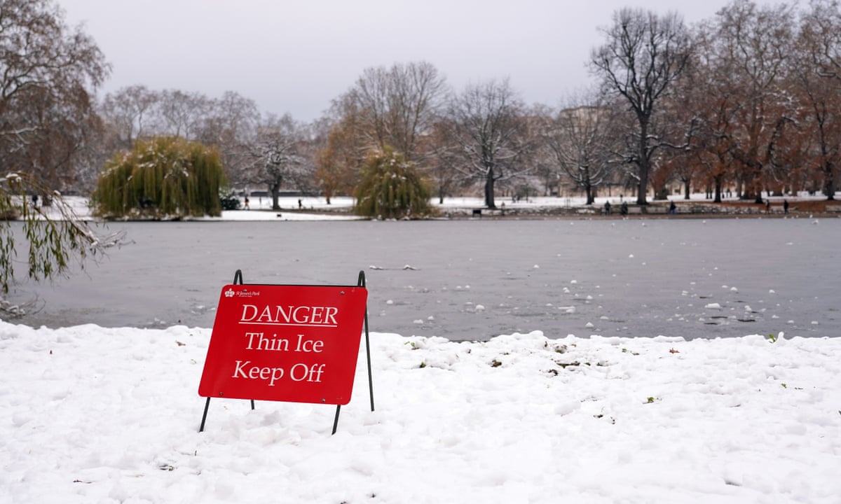 Warnings issued as people spotted walking on frozen lakes | UK news | The Guardian
