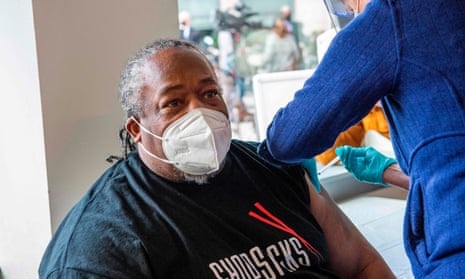 Frank Tate, a staff member and former client of The Open Hearth mens shelter, receives a Covid vaccine in Hartford, Connecticut on22 January 2021. 