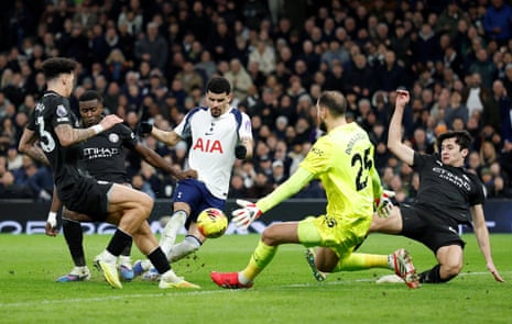 Dominic Solanke scores past Manchester City’s Gianluigi Donnarumma.