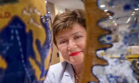 Managing Director of the IMF, Kristalina Georgieva, behind a globe made of art glass in her office in Washington DC.
